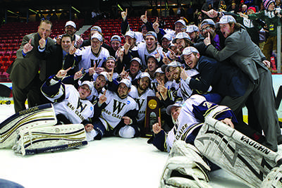 The UW-Eau Claire mens hockey team celebrates after winning the schools first national championship with a 5-3 victory over Oswego State (N.Y.) March 16.