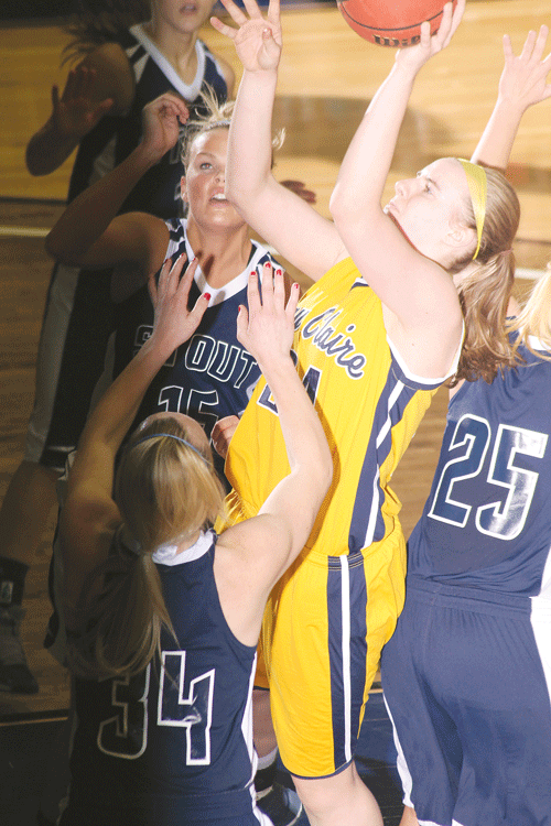 Freshman Ellen Blacklock goes up for a shot against three UW-Stout players on Jan. 25 at Zorn Arena.
