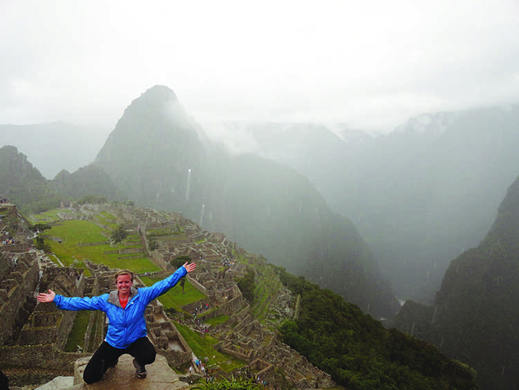 Mary Beth Hipple, UW-Eau Claire senior, poses for a photo at Machu Picchu  in Peru, South America. Machu Picchu  is one of the seven wonders of the world. © 2014 Martha Landry. 