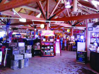 The Leinie Lodge features a ski-resort cabin-like feel, a fire place, couches and numerous memorabilia. 