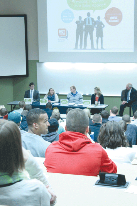 REAL WORLD: Kyle Thorpe, Ellie Fox, Aaron Severson and Emma Carlson, at the table, spoke to UW-Eau Claire students Tuesday about their experiences in the work force. © 2014 Katie Bast