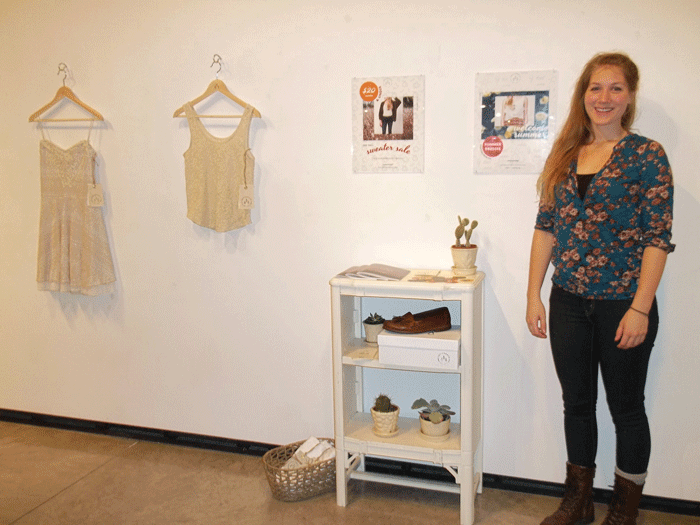 THATS SO FETCH: Senior Hannah Fechner standing with her clothing line display titled Invigorate, which is on display in The Foster Art Gallery in Early May. © 2014 Rachel Streich, The Spectator