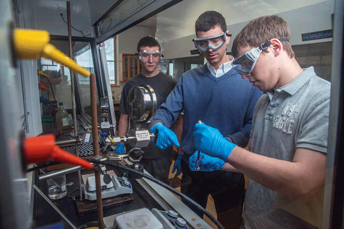 RESEARCH TO REUSE: Northland College professor and UW-Eau Claire alumnus Nick Robertson, center, is collaborating with university staff to find a more sustainable way to reuse plastic. Submitted