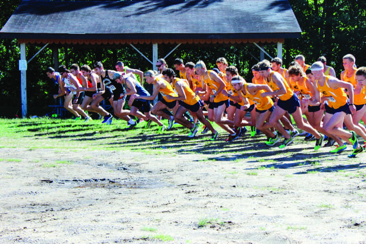 The men's cross country takes off at the starting line Saturday at Lowe's Creek.