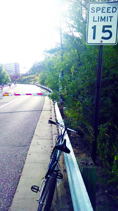 IT’S THERE FOR A REASON: University Police say not obeying the speed limit on the Garfield Avenue hill has been a factor in most bike crashes.