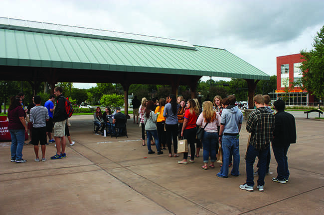 A big flock of UW-Eau Claire students tour the Phoenix Park area Friday night.