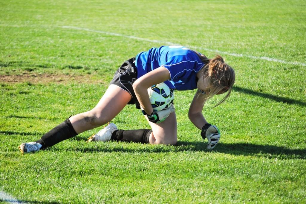 Sophomore goalie Rachel Griffiths records one of her five saves Saturday against UW-Oshkosh.