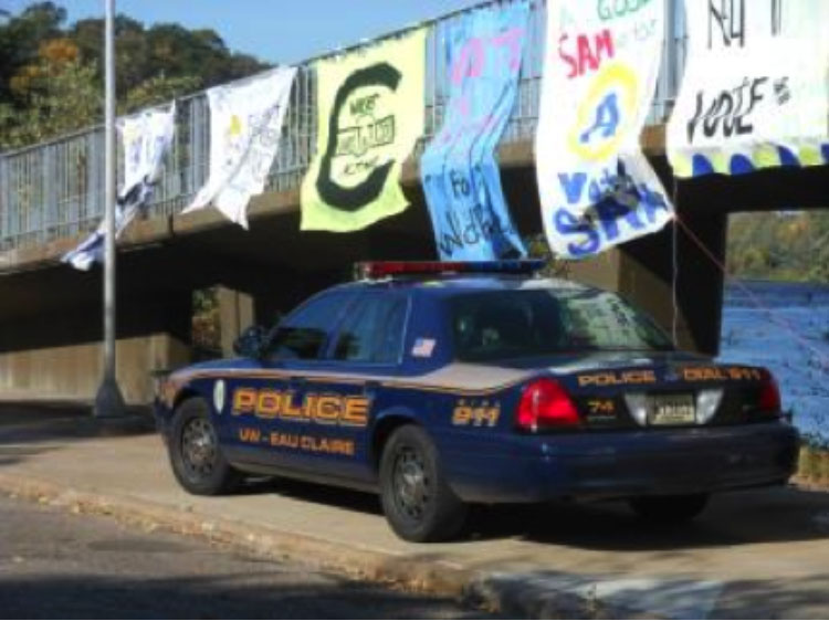 A+University+Police+car+sits+under+the+bridge+during+Homecoming+week+in+2013.+The+Student+Patrol+is+a+part+of+that+department.