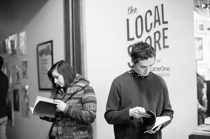 Community members picking up copies of NOTA at a book release party at The Local Store.