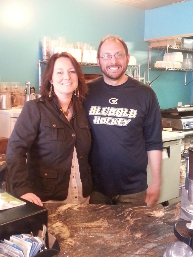 Owners Ryan and Laura Bembnister pose behind the counter of The Goat Coffee House, ready and excited to help the next customer who walks through the door.