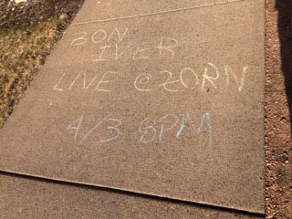 A message stating Bon Iver was to perform Friday was written around campus in chalk. It is in fact just an April Fools Day joke. 