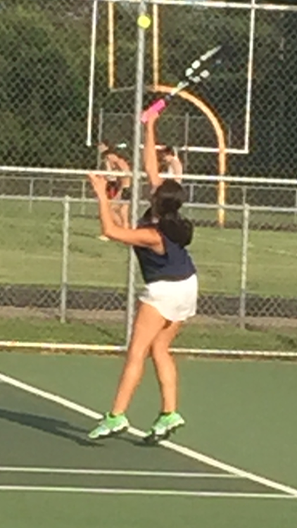 Paige Kuepers serves against La Crosse’s Sadie Spahn this past Saturday. Kuepers brought the match to a third set before eventually being defeated. 