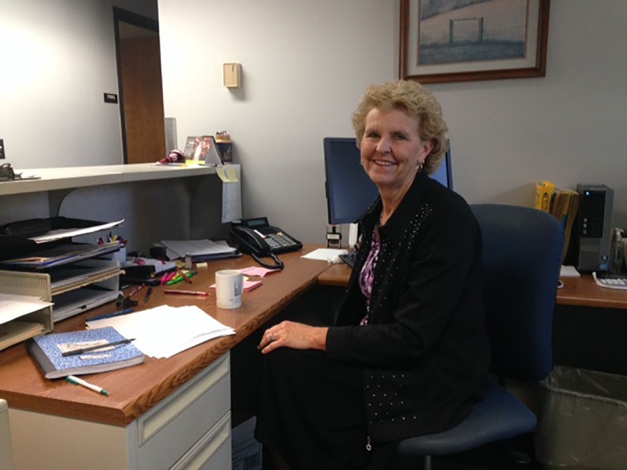 Saying goodbye with a smile: Susan Brumberg-Schaefer poses at her desk during her last week as the secretary for the University Police. 