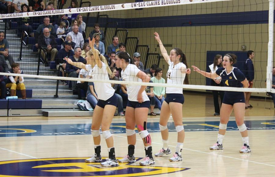 Keagan Kinsella, Jenna Smits, Hannah Theisen and Talia Jaskulske await the serve against the Pointers.