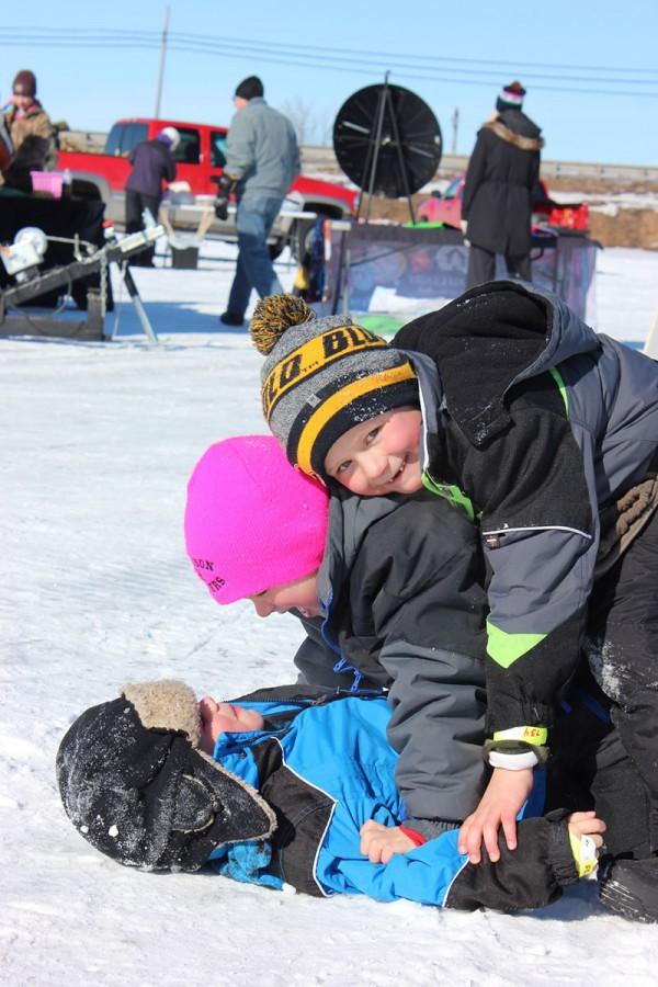 Bottom to top: Four-year-old William, 6-year-olds Henry and Abbott after participating in the Kids Klub contest of the Jig’s Up ice-fishing event Saturday on Lake Altoona.