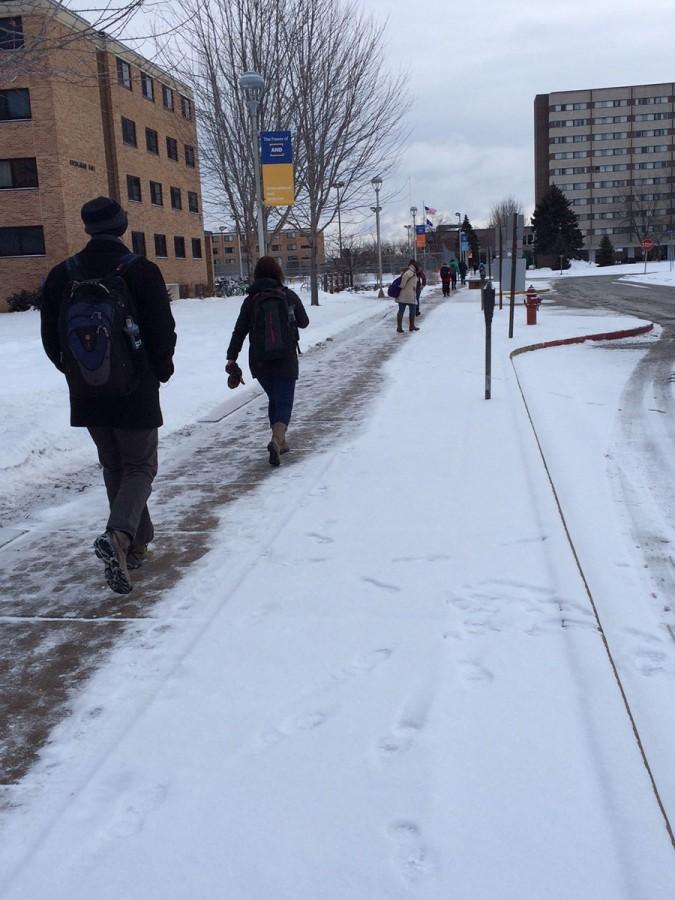 UW-Eau Claire students brave the cold while walking to class from their dorms
