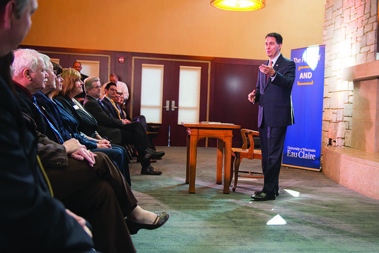 Gov. Scott Walker stopped by UW-Eau Claire monday to sign a bill that requires higher education institutions to mail students annual updates on their student loans. He addressed a group of about 30 in the Alumni Room of the Davies Center. 