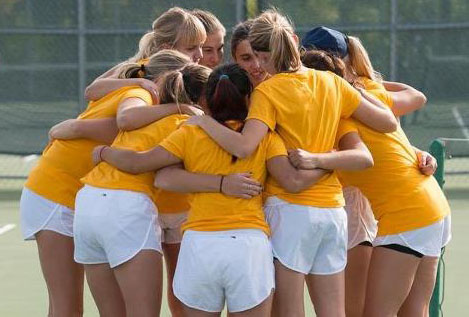 The Blugold women’s tennis team huddles up prior to their final home matches outside of McPhee Physical Education Center this past weekend.