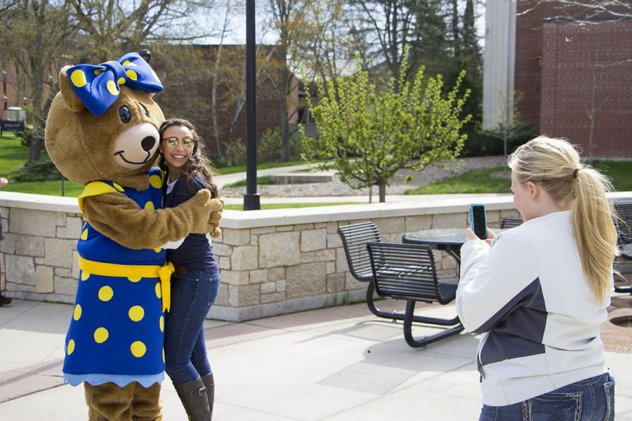 Junior CSD student Emmy Gerome poses for a photo with the Autism Speaks mascot at the 11th annual 24-hour event for the Epsilon Alpha chapter of Alpha Xi Delta. 