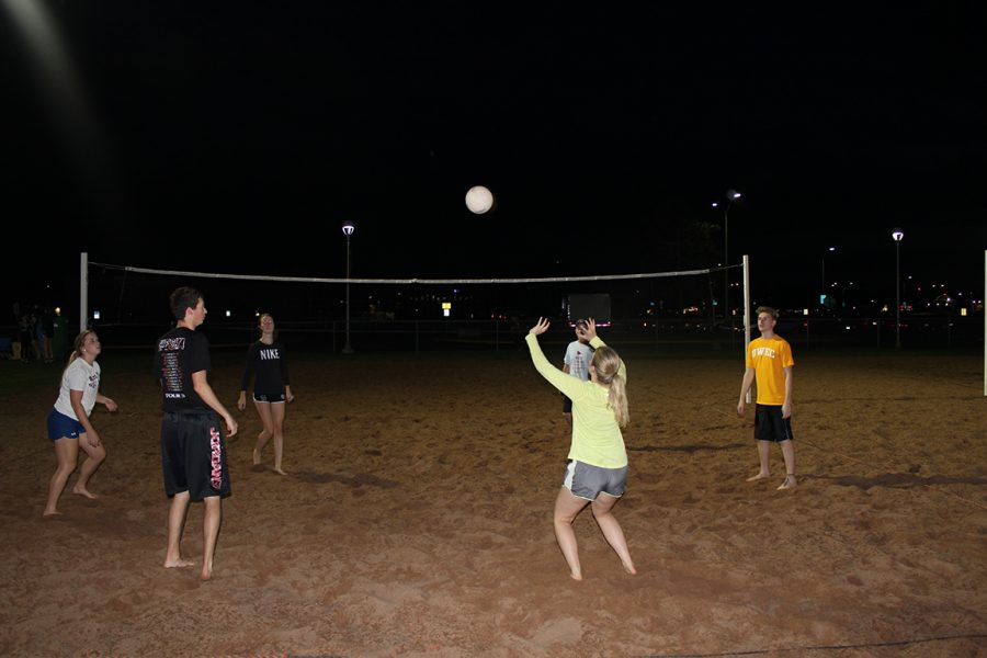 Team named “Sets on the beach” warm up on the Tower’s field sand volleyball court before their game at 8:00 p.m. on Tuesday. 