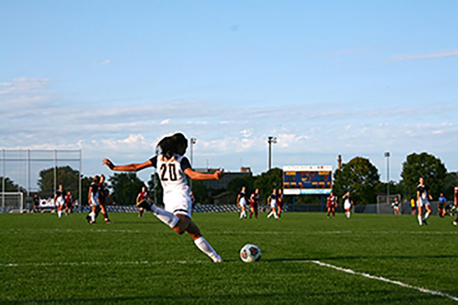 #20, Eva Charesworth-Seiler takes a goal kick from the goalies box at the varsity women’s soccer game Saturday.
