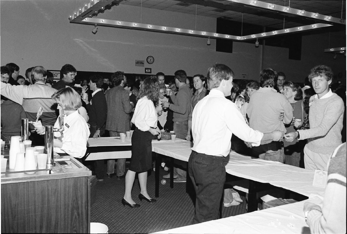 During homecoming weekend 1986, alumni could attend a brunch, open house, dinner and masquerade dance. Shown is the bar area during the open house. 