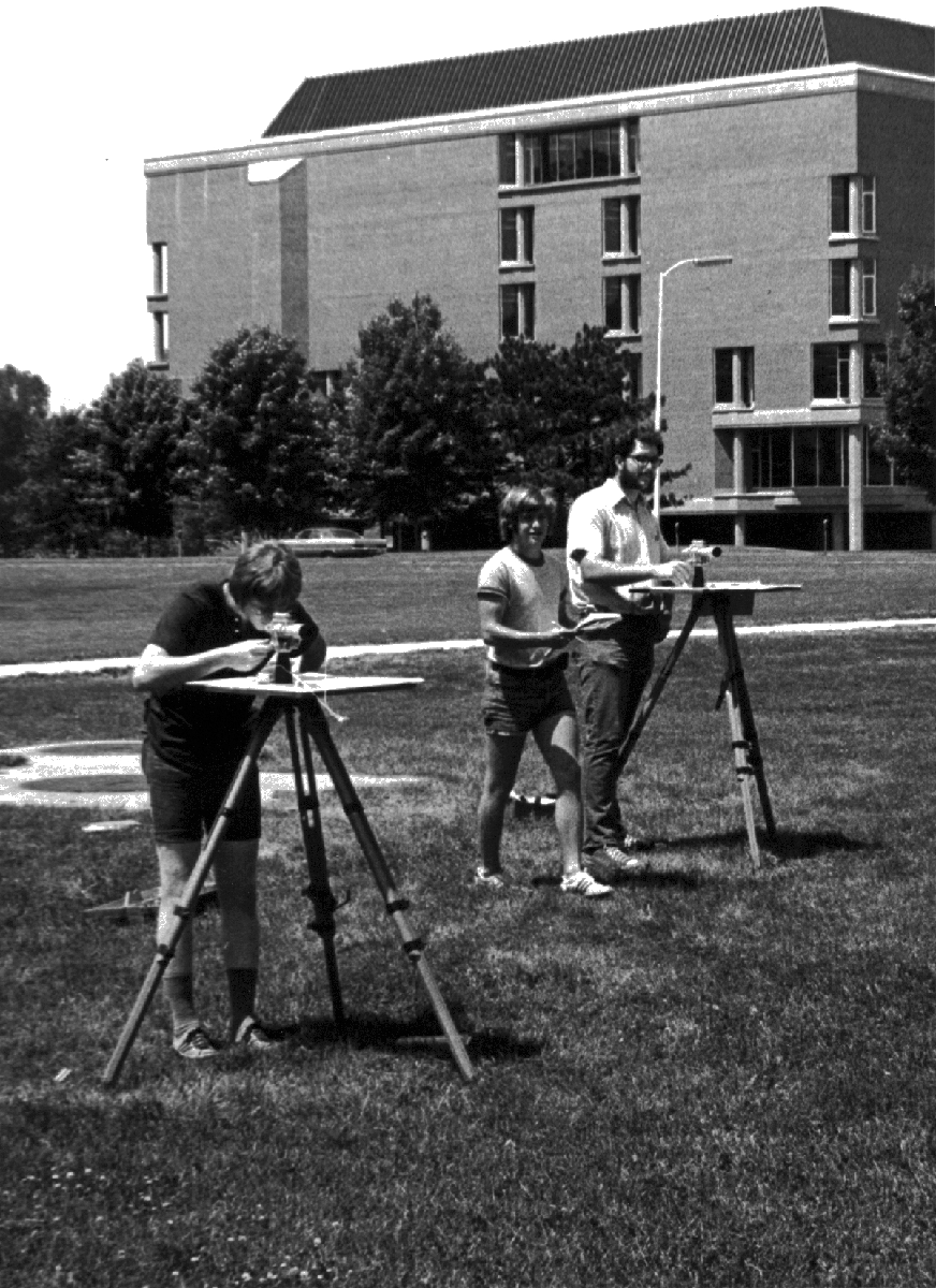 Students in 1973 used geology surveying equipment on lower campus for one of their geology courses.