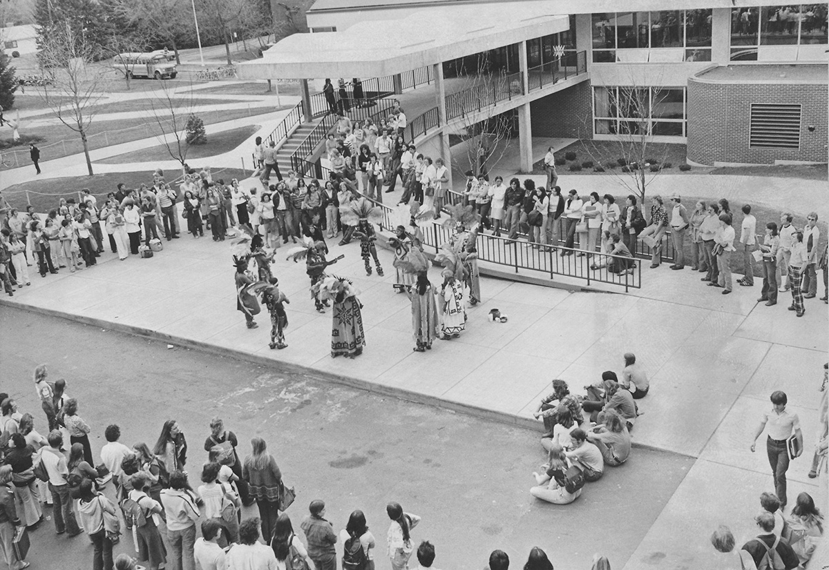 In 1977, native dancers performed for American Indian Awareness week outside Davies Center.