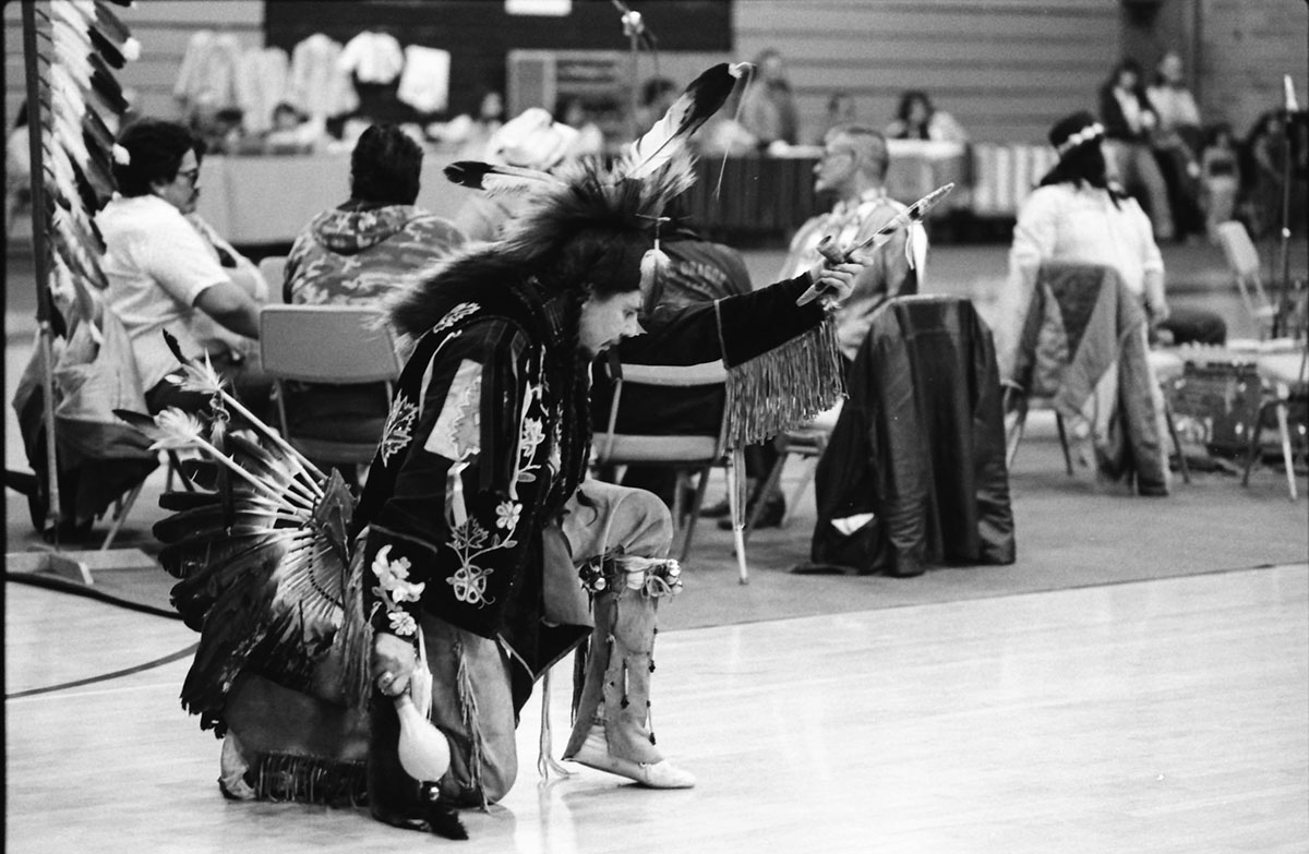 The annual Honoring Education Pow Wow allows members of Native American tribes and other community members to celebrate American Indian cultures through traditional song and dance. Shown here is a dancer at the Pow Wow in 1983.