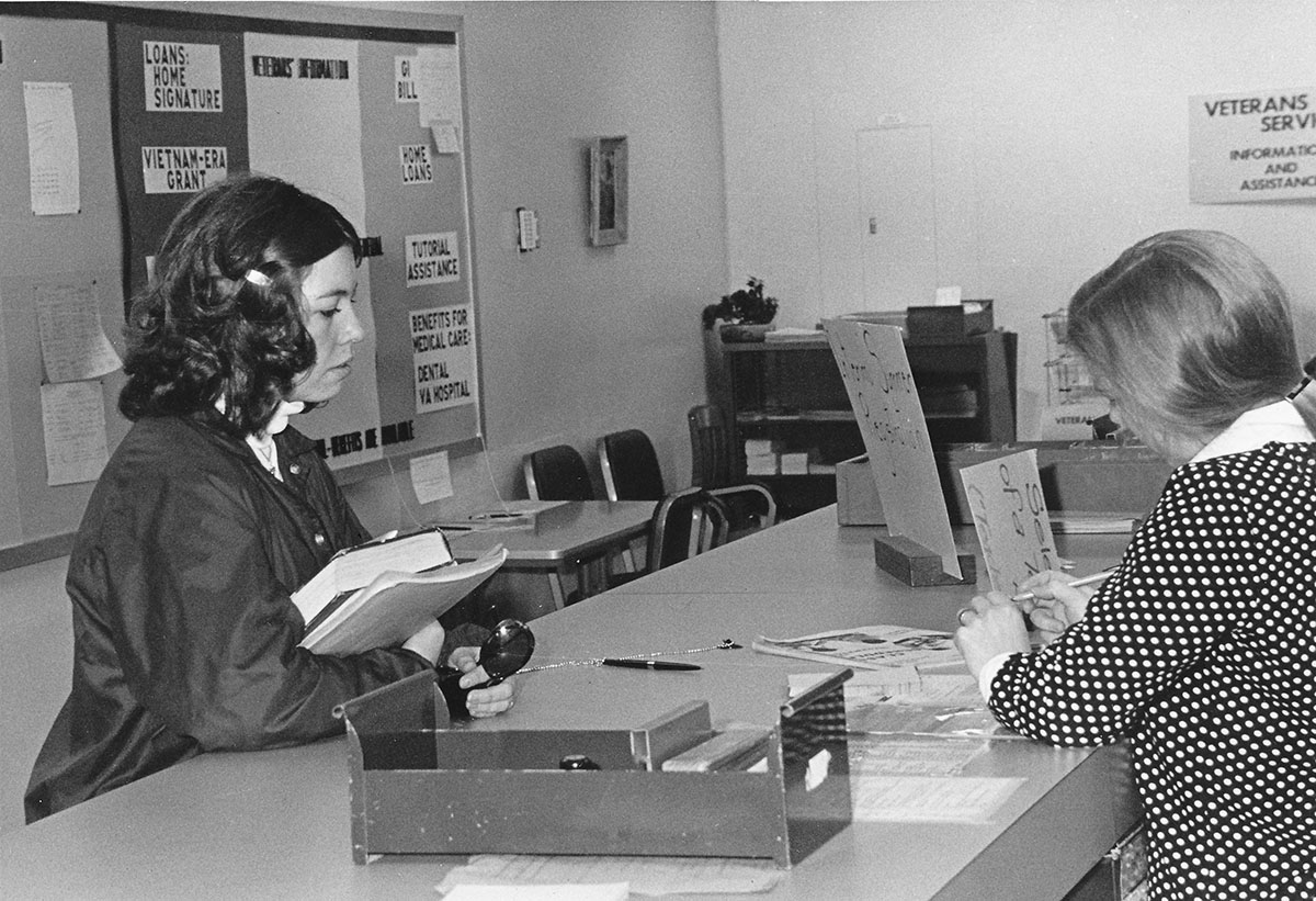 Seen here is a student at the Veteran Services Registration desk in the 1970s. Many benefits are available to veterans through the Veterans Center and Veterans Services on campus.