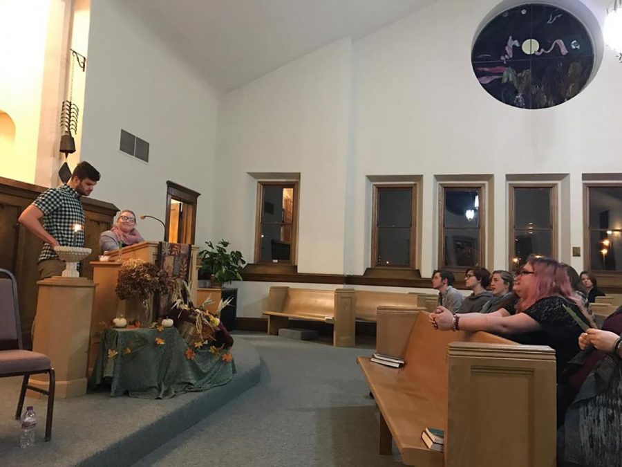 Alex+DeLakis+%28left%29%2C+event+organizer+and+Q2+facilitar%2C+speaks+to+the+crowd+gathered+to+honor+the+lives+lost+to+anti-trans+violence+at+the+Unitarian+Universalist+church+on+Barstow+St.+Monday+night.