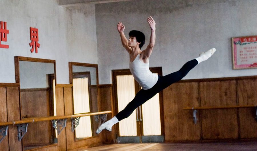 Li Cunxin dances in one of the ballet academy’s practice rooms in “Mao’s Last Dancer.”