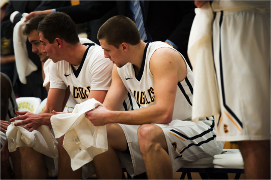 Blugold men’s basketball player Josh Weix, takes a breather at half-time.