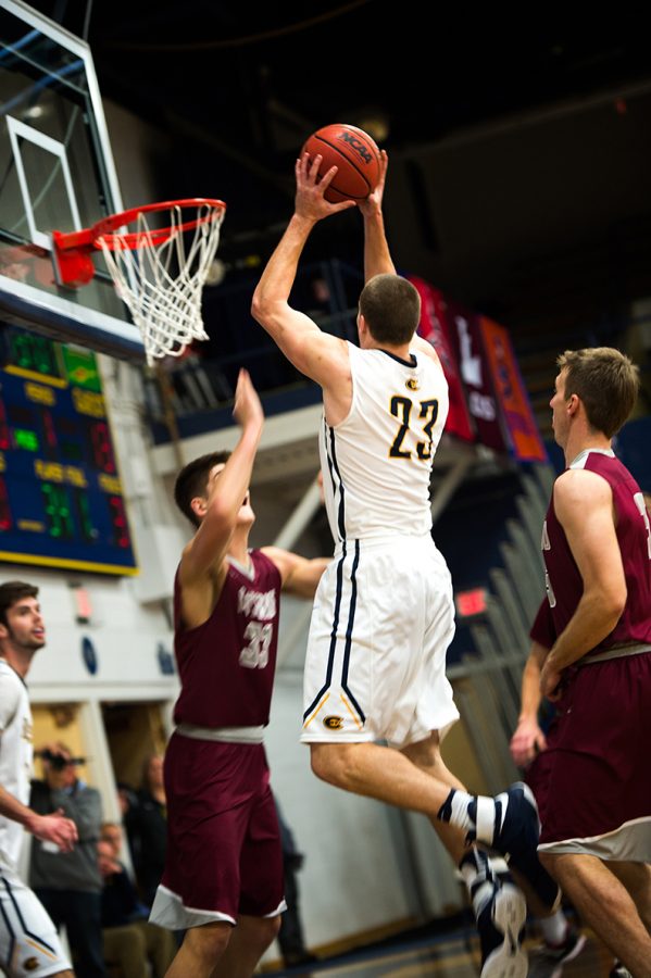 Freshman Josh Weix aims and shoots during a game against Viterbo University. 