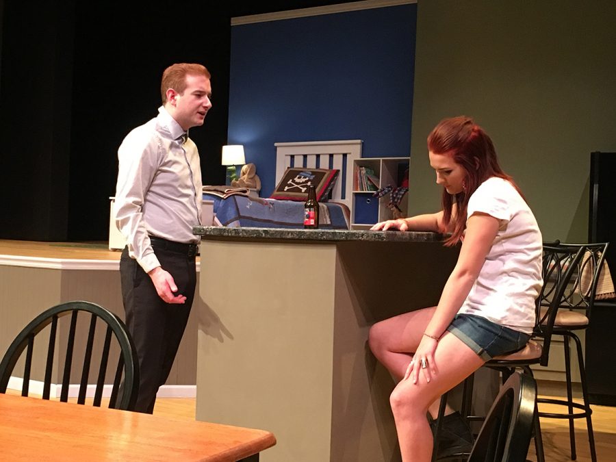  UW-Eau Claire’s theatre production of “Rabbit Hole” depicts fifth year senior theatre arts student Cory McMenomy as Howie and senior advertising student Sidney Fairbrother as Izzy, who are arguing about the best way to deal with their tragic situation.
