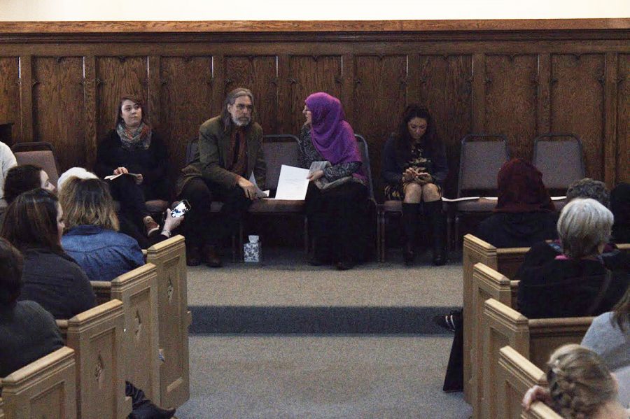 Speakers sit toward the front of the Unitarian Universalist Congregation Wednesday night. Around a dozen speakers addressed issues concerning President Trump’s recent executive order barring immigrants from seven countries. 