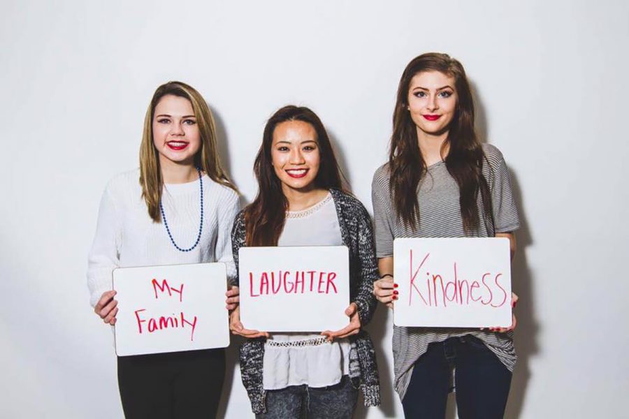 Participants in the Red Lips Project will have their photo taken with what makes them feel powerful. (Pictured left to right: Taylor Stoltz, Wendy Vang and Madi Mischo) (Submitted)