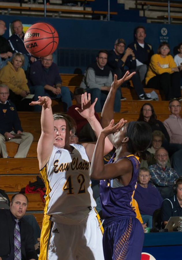 Junior forward Kayla Hanley attempts a shot over her defender.