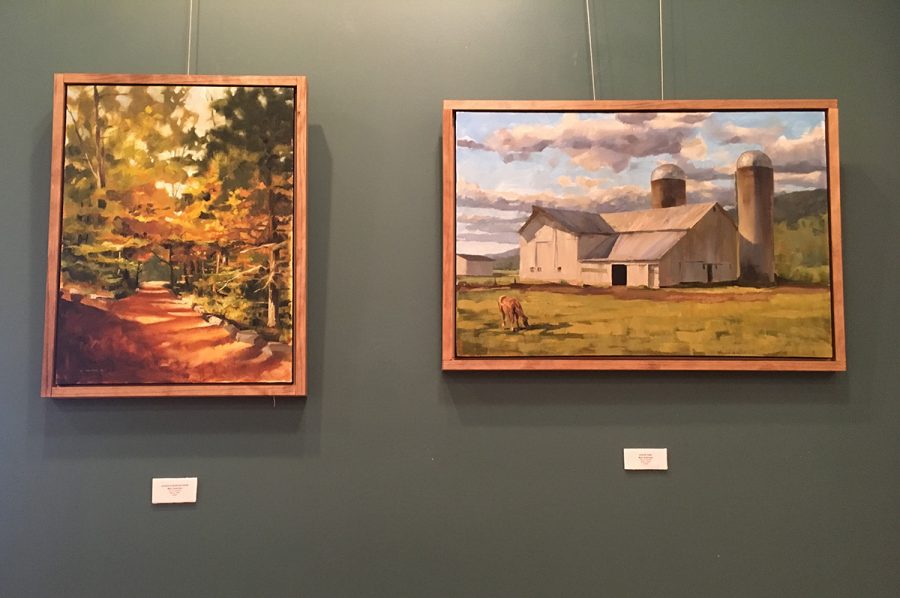 Two of Marc Anderson’s paintings, “Justin’s Dappled Path,” and “Snack Time,” depict still images of rural life.