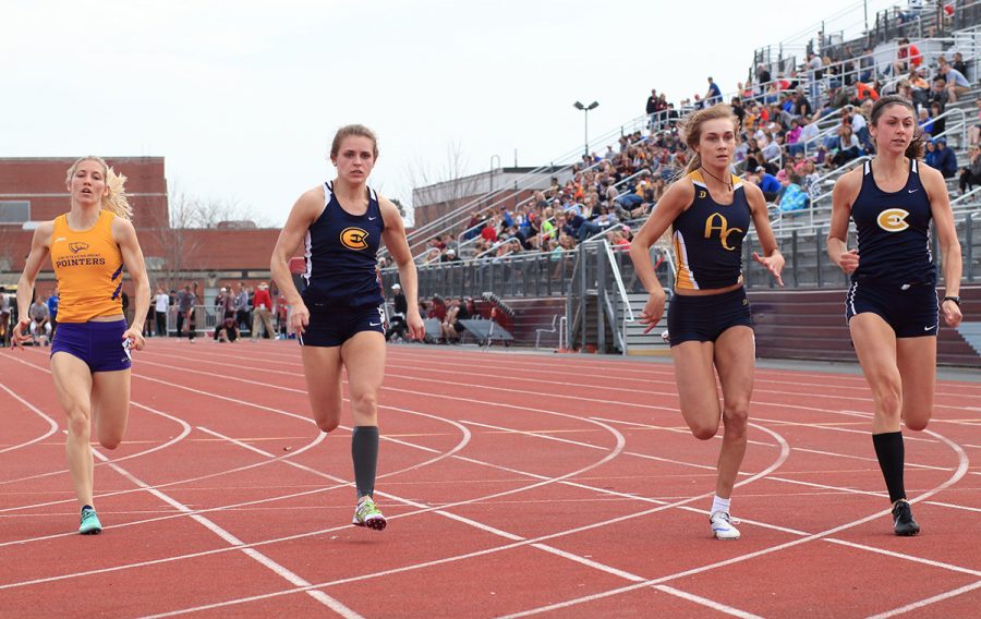 Claire Fischer (left) and Kelsey Worachek (right) compete in the 100-meter dash at the Ashton May Invitational on Saturday.