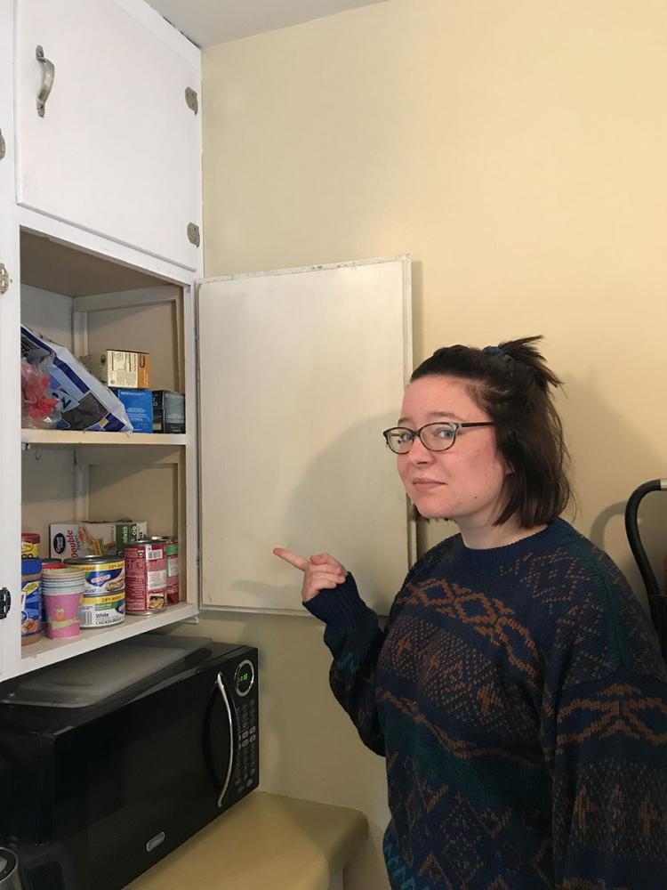 Faith looks at her meager collection of canned food in dismay. National Geographic has told her she won’t live longer than a fortnight when the apocalypse hits.