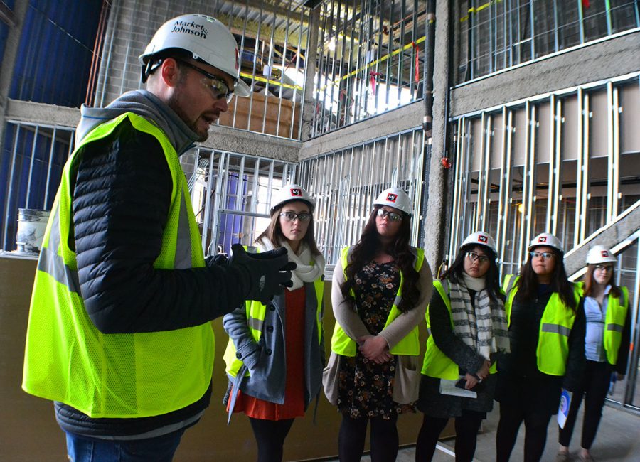 Student senators walk through the Confluence Arts Center on a tour guided by Jason Jon Anderson, the executive director of the project. The building is set to open in Fall 2018.
