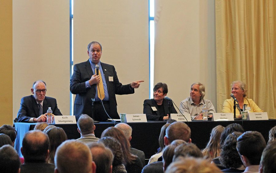 A panel of shared governance leaders led the open forum in the Dakota Room last Thursday. Pictured from left to right is Keith Montgomery, regional executive office and dean; UW-Eau Claire Chancellor James C. Schmidt; Patricia Kleine, provost and vice chancellor of academic affairs at UW-Eau Claire; Evan Weiher, chair of UW-Eau Claire university senate; and Lauren Wentz, an associate biology professor at UW-Barron County. 
