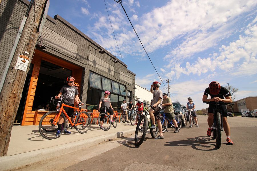 The National Bike Month and grand opening events included community bike rides, records and spin art.