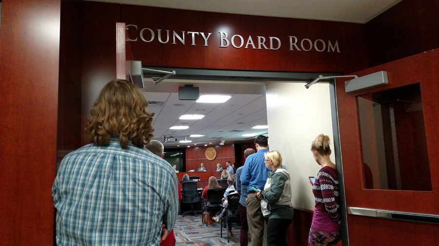 The room overflowed with people wanting to attend the city council meeting.