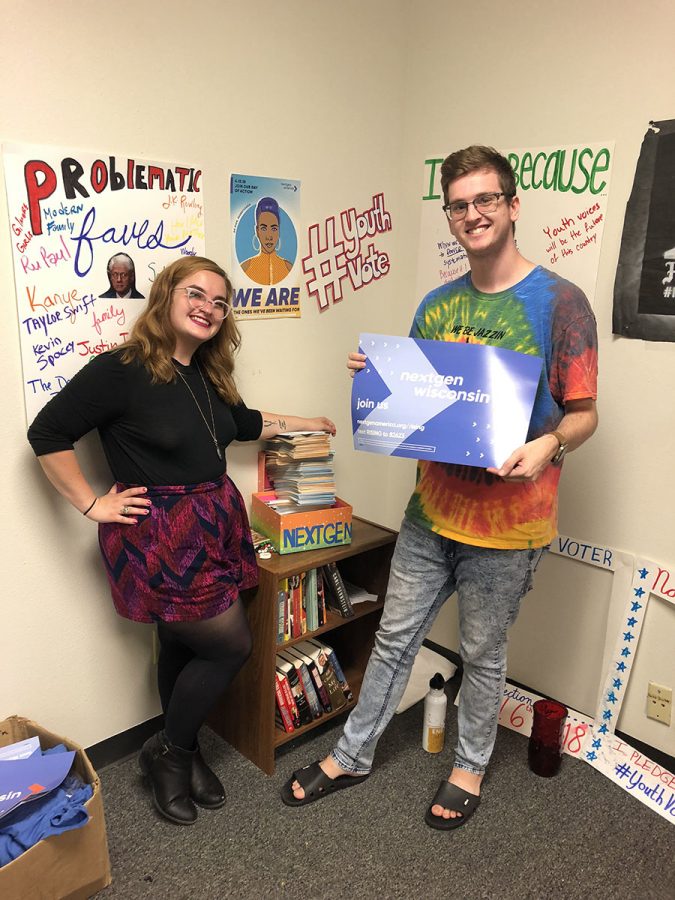 NextGen Wisconsin Fellows Kessa Albright and David Edwardson stand by their stack of recently attained Pledge to Vote cards.
