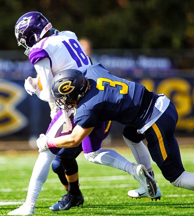 Cameron Swanson, a third-year student, goes in for the ball against No. 13 on UW-Whitewater’s offense.