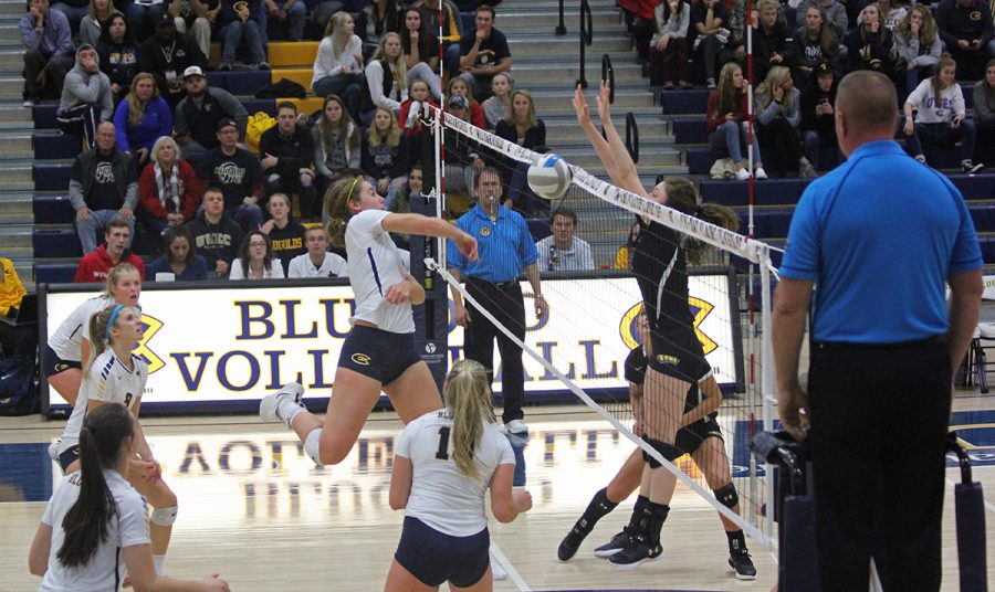 Abby+Volk+delivers+a+spike+against+UW-Stevens+Point.