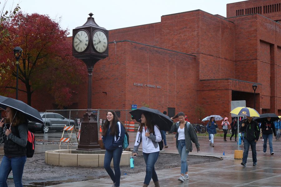Students pass by the latest, historic addition to campus.
