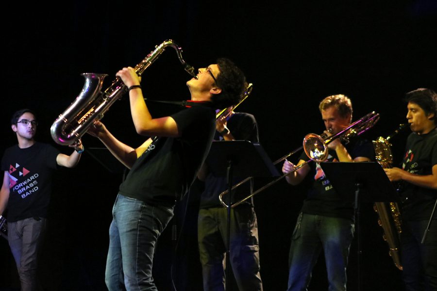 Jonny Zajac from the Forward Brass Band showcases his love for music by jumping to the beat of “Take On Me” by a-ha!